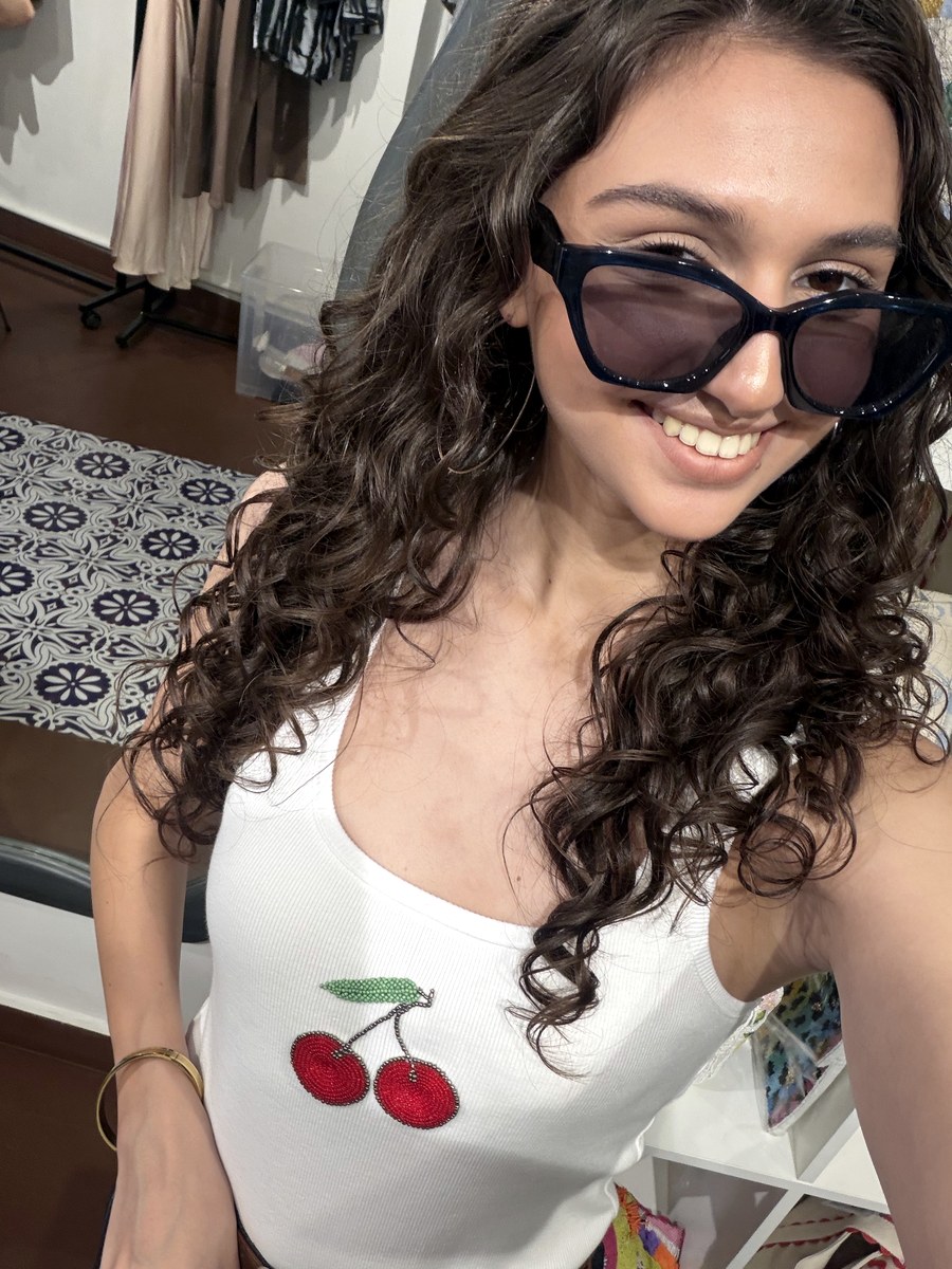 Selfie of a customer in a cherry print piece